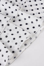 Falda de corte en A con volantes y cintura baja, con estampado de lunares