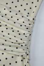 Top beige con lunares y lazo en la cintura