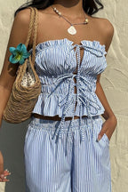 Conjunto de top tubular con lazo delantero y pantalones a rayas