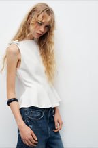 Casual sleeveless top with a tie detail at the hem and a sweet style