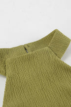 Green halter neck top and pleated wide-leg pants set