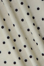 Top beige con lunares y lazo en la cintura
