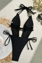 Bañador de una pieza negro de malla, con cuello halter y corte alto