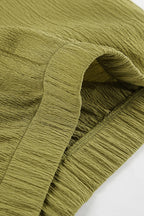 Green halter neck top and pleated wide-leg pants set