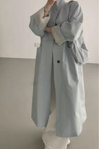 Loose-fitting paneled coat in a mixed-fabric, medium-length design