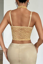 Top corsé de encaje y malla con cuello halter