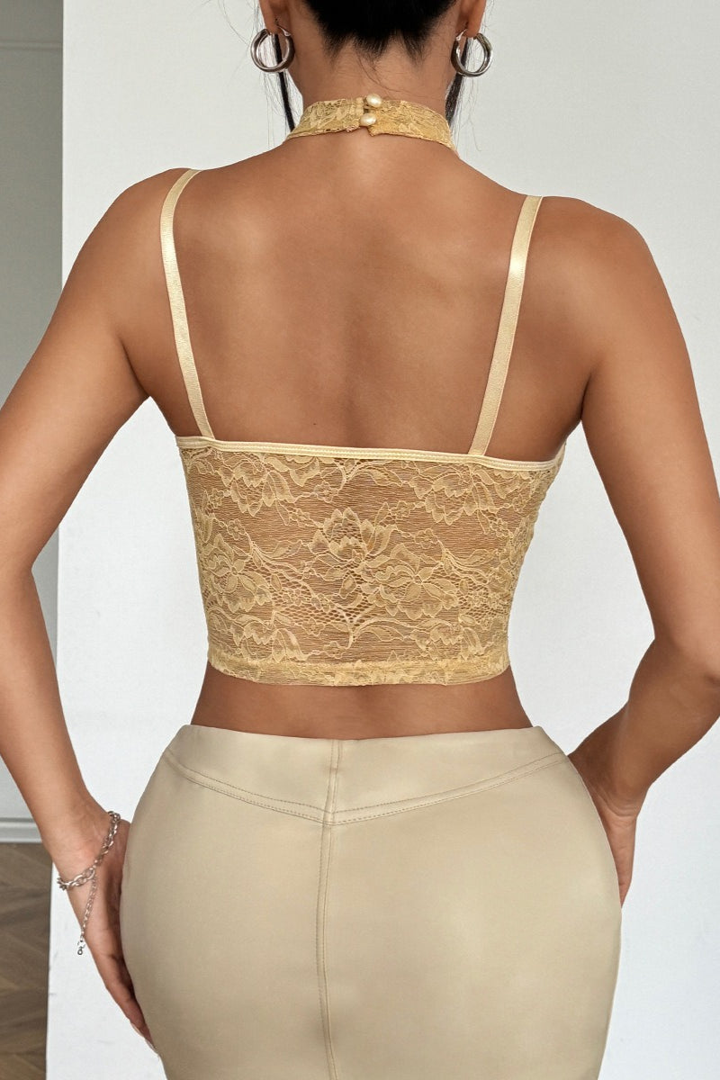 Top corsé de encaje y malla con cuello halter