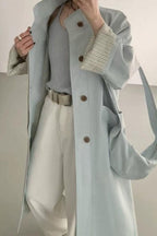 Loose-fitting paneled coat in a mixed-fabric, medium-length design