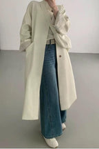 Loose-fitting paneled coat in a mixed-fabric, medium-length design