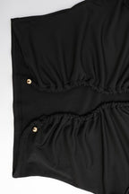Conjunto elegante de top ceñido con fruncidos y pantalones