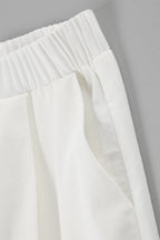 Casual wide-leg pants set with ruffled sleeves, crafted from a linen blend