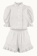 Conjunto de cuello alto, manga abullonada y shorts con volantes