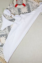 White three-piece swimsuit with ruching and high-cut leg