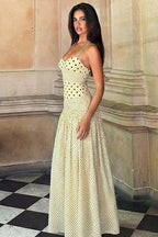 Retro style halter maxi dress with polka dots, patchwork, and ruching