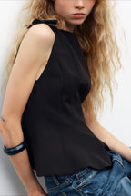 Casual sleeveless top with a tie detail at the hem and a sweet style