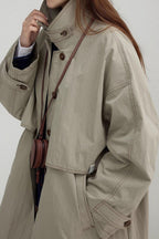 Long vintage-style coat with a high collar