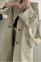 Loose-fitting paneled coat in a mixed-fabric, medium-length design