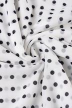 Falda de corte en A con volantes y cintura baja, con estampado de lunares