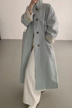 Loose-fitting paneled coat in a mixed-fabric, medium-length design