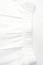 Conjunto de top corto de manga larga y pantalones en color liso